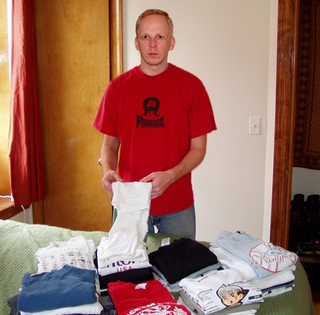 Cisnek and some of his favorite T-shirts.